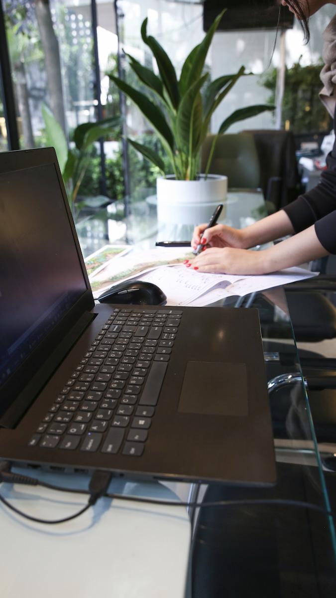 image of a cafe with plants behind it